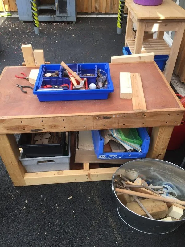 Outdoor woodwork bench with tools laid out, Ysgol Feithrin Y Trallwng, Welshpool