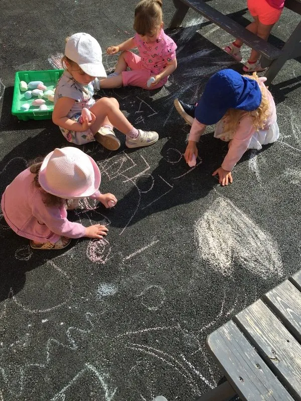 Two children playing at the mud kitchen, Ysgol Feithrin Y Trallwng, Welshpool