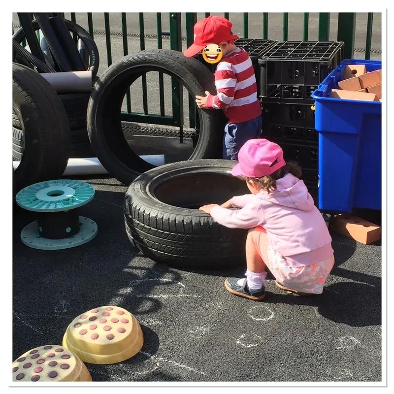 Outdoor play area with tyres and water play, Ysgol Feithrin Y Trallwng, Welshpool